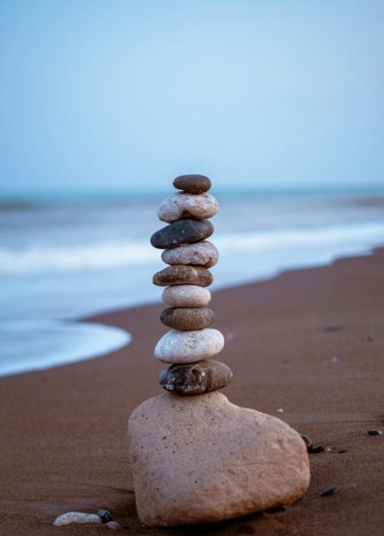 Tranquil stone stack on Mersin beach, Türkiye, encapsulating balance and zen.